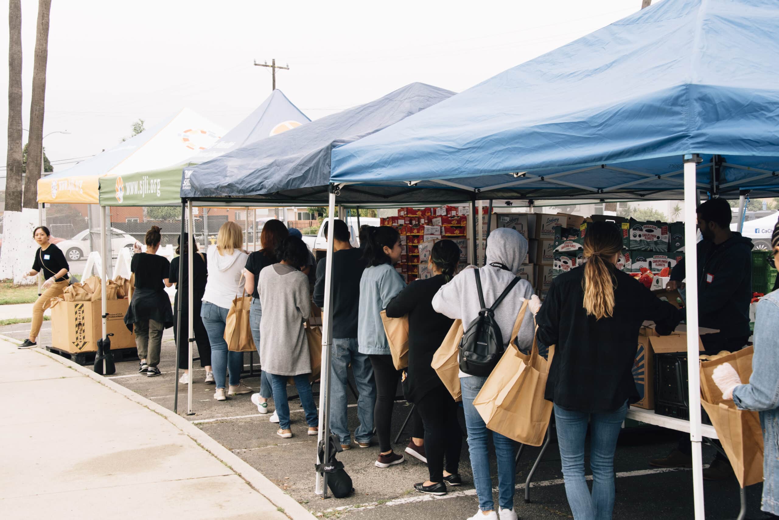 People lining up at food distribution